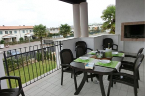Poolside views from comfy apartment Bibione